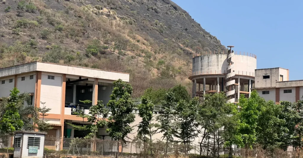 New Water Infrastructure for Nashik 2027 The large water treatment facility and storage towers near the hills in Nashik, Maharashtra.